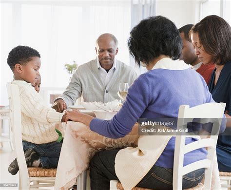 African American Family Praying Before Meal High-Res Stock Photo - Getty Images