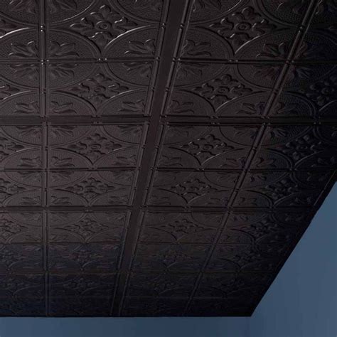 the ceiling is made up of black tin tiles