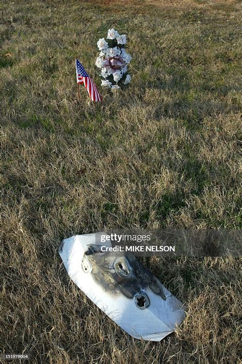 A piece of debris from the Space Shuttle Columbia and a make-shift... News Photo - Getty Images