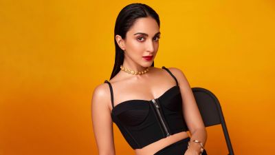 Kiara Advani, Black dress, Orange background, Indian actress