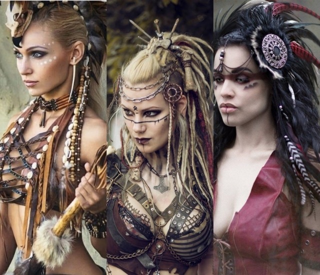 3 images stacked together vertically. The 3 images have 3 white women dressed very similarly. The first woman is blonde, holding a wooden & furred weapon, with a feathered head piece, & a bone choker & breastplate obviously based off of Native American ones. She has white dots along her eyes. The middle photo features another blonde woman with matted hair 'dreadlocks' with bone jewelery in her hair, a leather bra, dark makeup with a rune on her forehead, and a dreamcatcher like ornament in her hair. The last woman on the right photo is black haired, with a red streak of makeup along her eyes, a single black line going down her chin, a red leather vest showing her cleavage, and wearing a black feathered headdress obviously nodeled off of Native American war bonnets, & with also a dreamcatcher like ornament within in. End ID