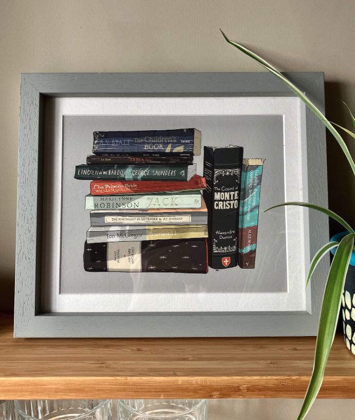 A framed custom print of favourite books