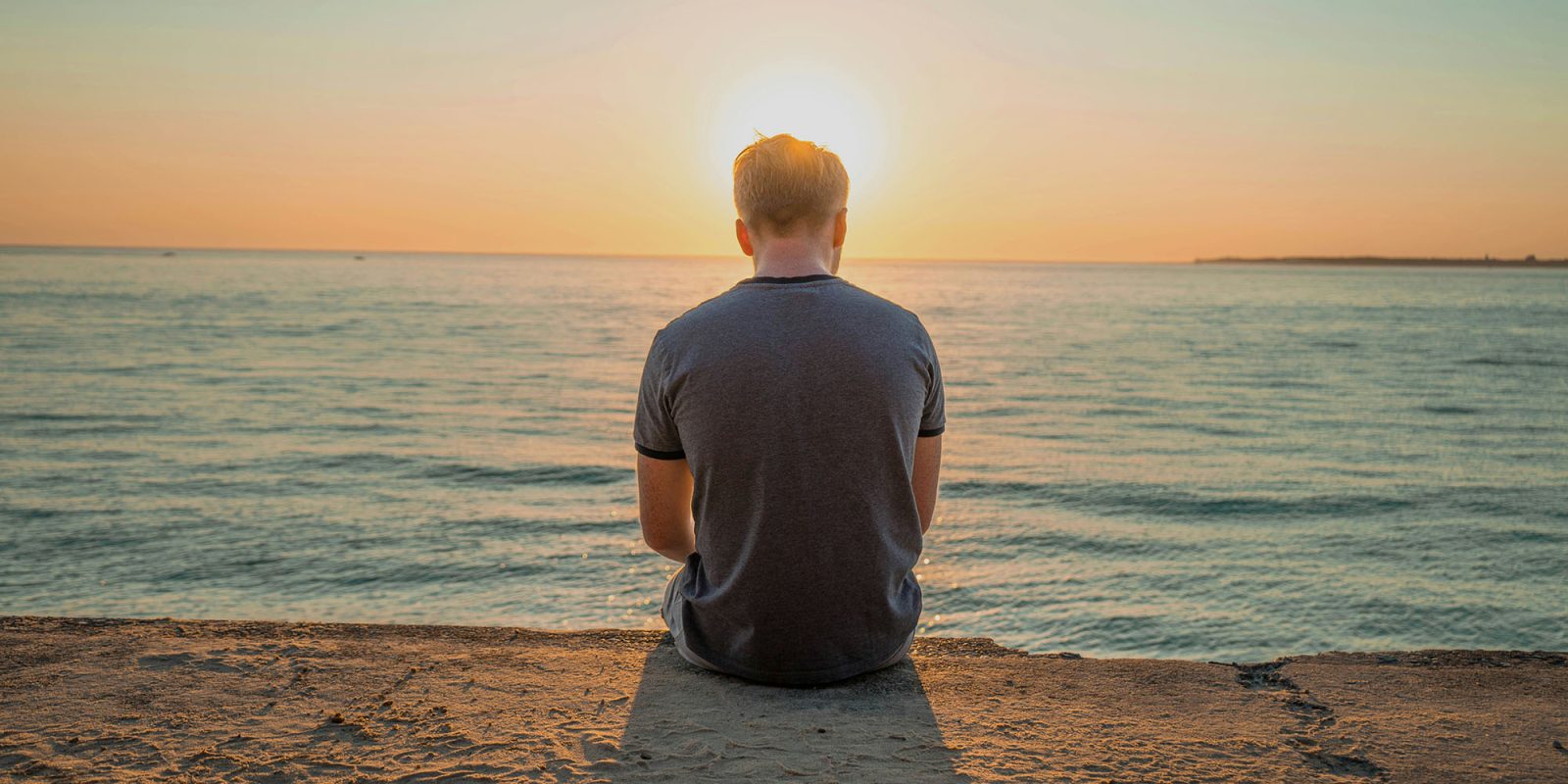 Unfollow Everything | Back of a man looking out to sea