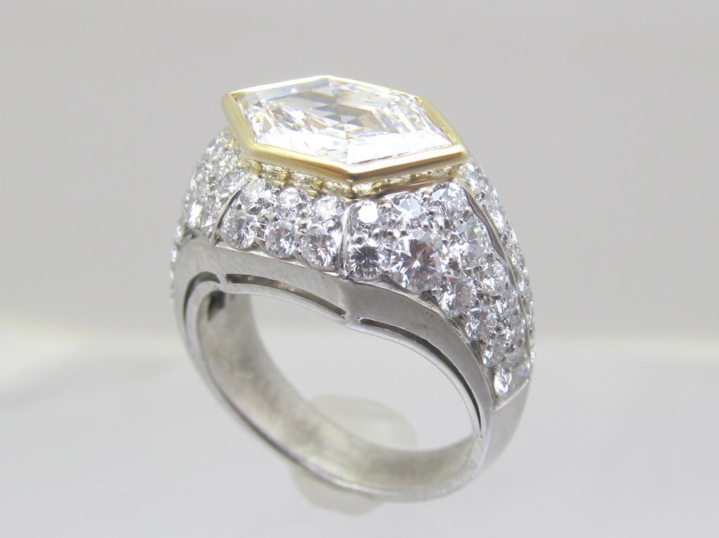 Impressive Bulgari Ring!!!!
Centering a hexagon-shaped diamond encrusted in 18k gold
weight is approximately 2.75 carats,
 Color F/G 
Clarity VVS-VS1
 Accented by round diamonds weighing approximately 2.45 carats, set in platinum
 Ring size is