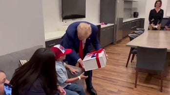 Former President Trump surprises young supporter at rally with birthday gift, visit