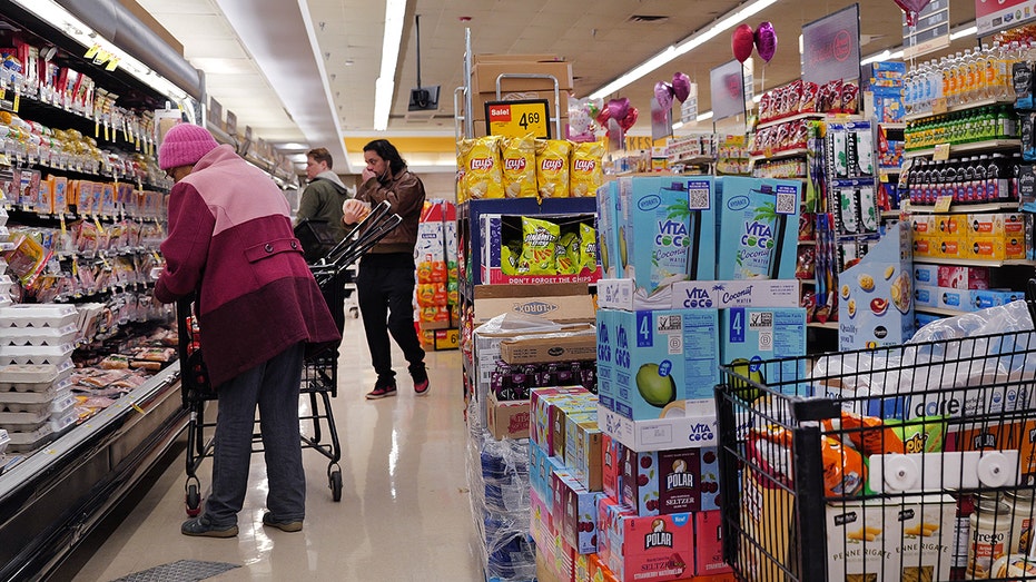 Customers shop at a grocery store in Chicago