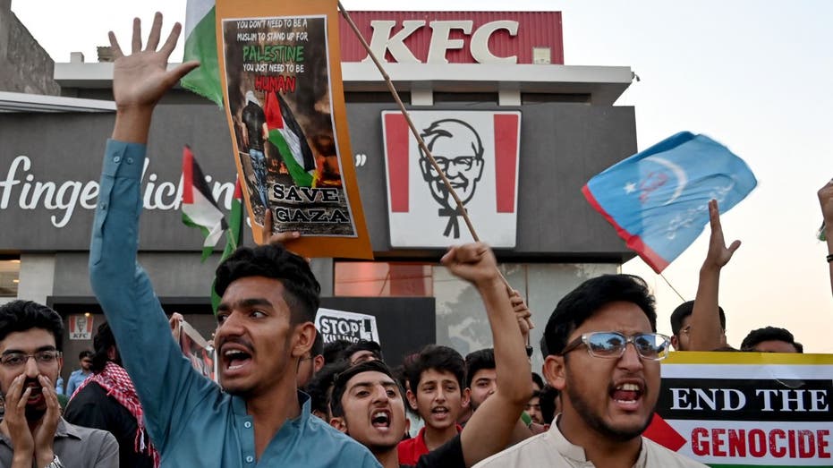 Pro-Palestinian protesters demonstrate outside a KFC in Pakistan