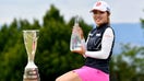 Ayaka Furue of Japan poses with the trophy after wining the Amundi Evian Championship on the 18th hole  during the final round of the Amundi Evian Championship at Evian Resort Golf Club on July 14, 2024 in Evian-les-Bains, France.