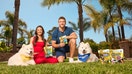 Kristin and Kyle Juszczyk sit with dogs