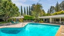 The 1950s home also has a backyard pool. 
