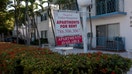 An &apos;Apartments for Rent&apos; sign hangs in front of a building on December 6, 2022 in Miami Beach, Florida. 