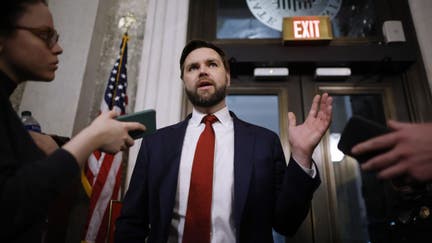 Sen. J.D. Vance (R-OH) (C) talks to reporters between votes at the U.S. Capitol on February 12, 2024 in Washington, DC. Following a series of evening votes, the Senate will stay in session all night with the goal of passing national security legislation that would send $95 billion in military aid to Ukraine, Israel and Taiwan. 