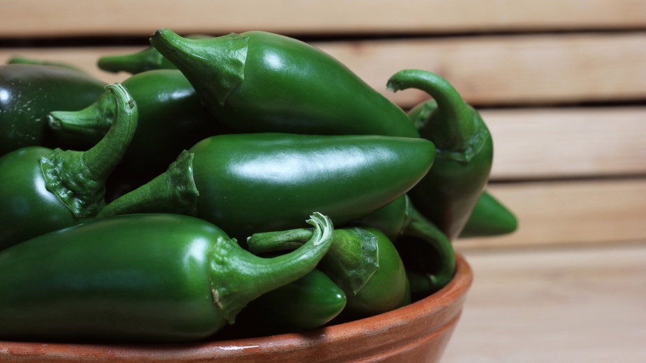 A bowl of jalapeno peppers.