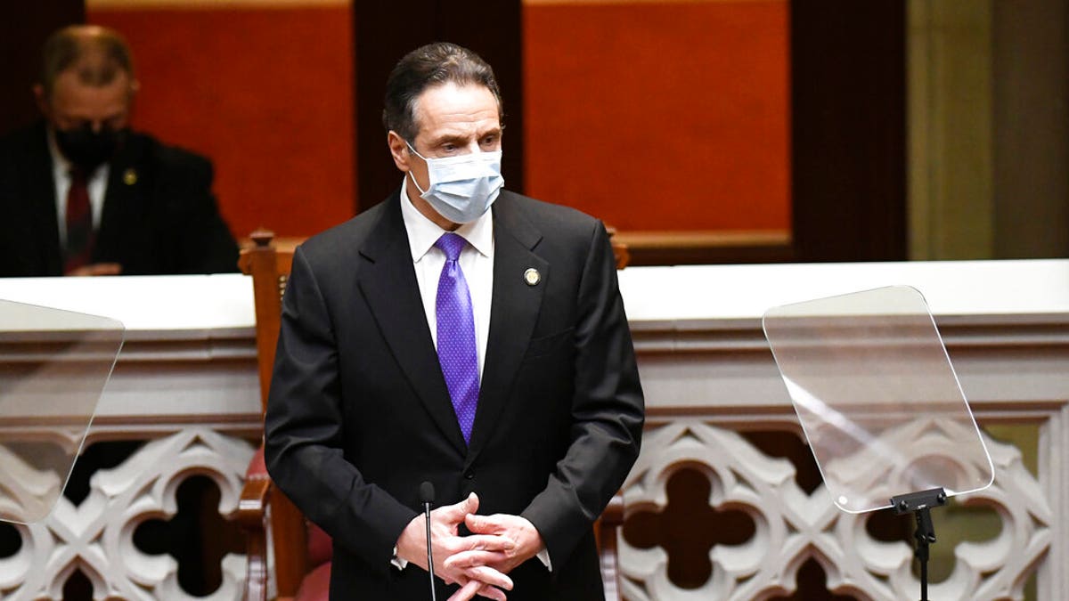 New York Gov. Andrew Cuomo speaks to members of New York state's Electoral College before voting for president and vice president in the Assembly Chamber at the state Capitol in Albany, N.Y., Monday, Dec. 14, 2020. (AP Photo/Hans Pennink, Pool)