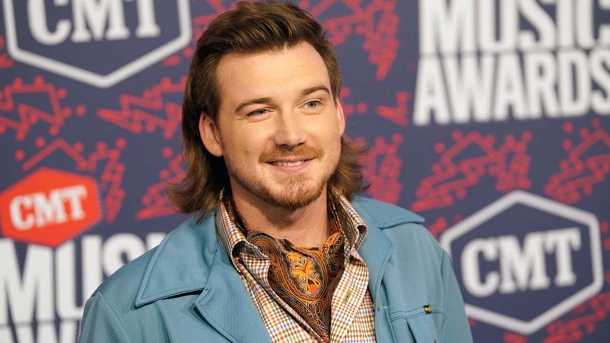 Morgan Wallen's album sales are increasing despite a recent scandal involving the use of a racial slur.