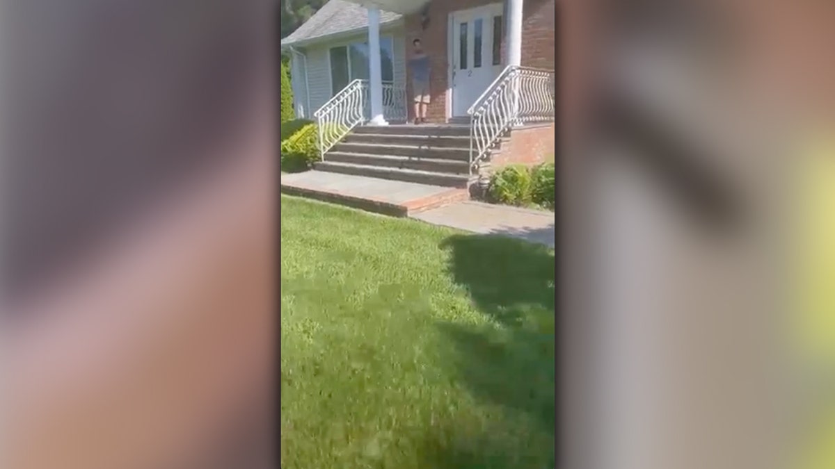 Man arrives home to find another man standing on his porch