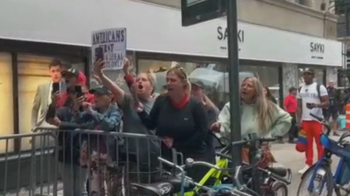 NYC migrant crisis protesters shout