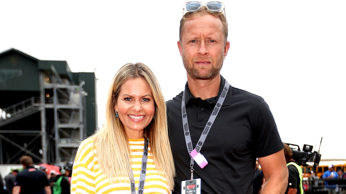 Candace Cameron Bure and her husband at NASCAR