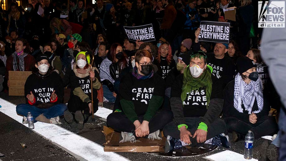 Protests sit during a demonstration