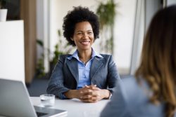 Financial Advisor smiling at client