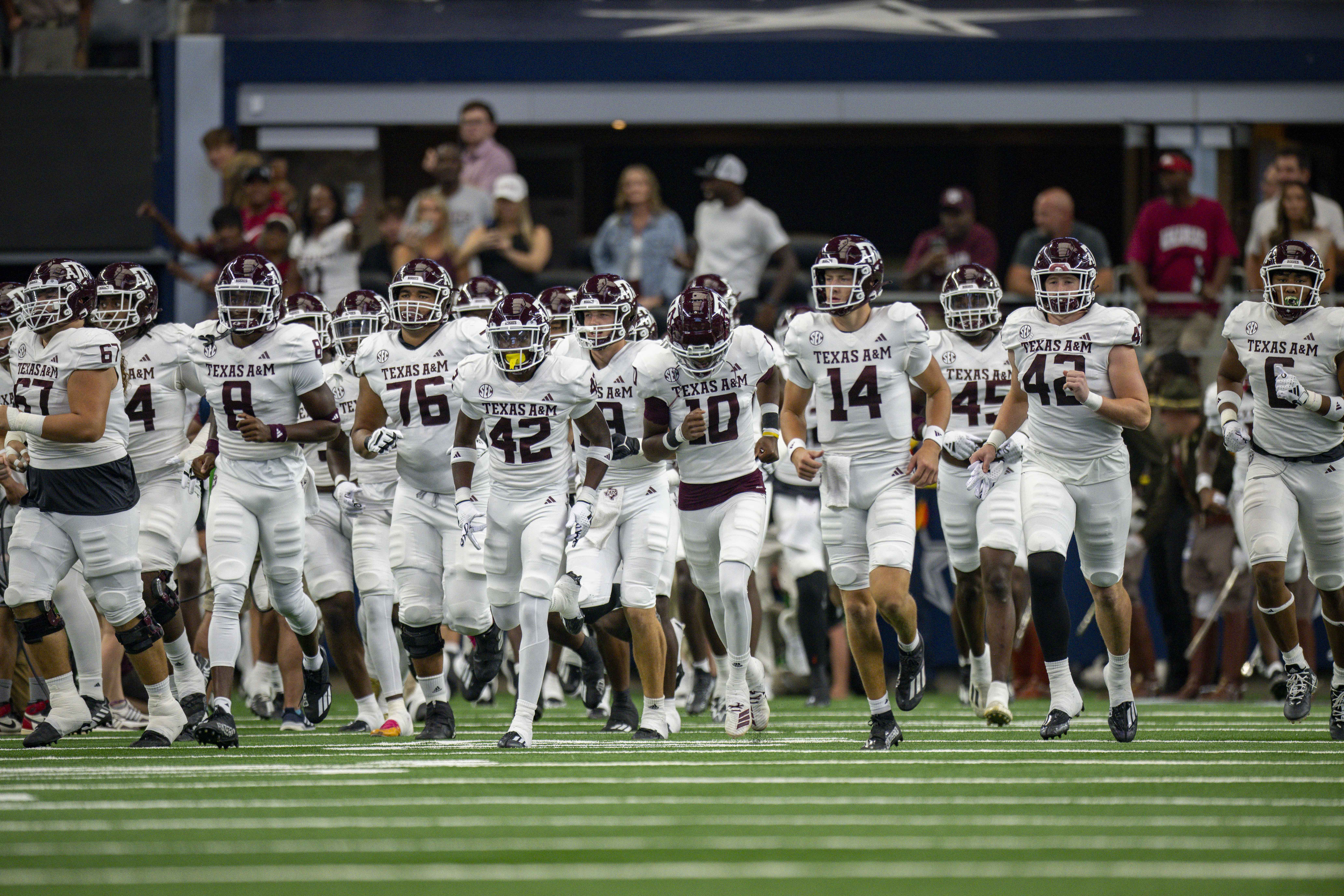 Sep 30, 2023; Arlington, Texas; Texas A&M Aggies quarterback Max Johnson (14) and the Aggies take the field before the game between the Texas A&M Aggies and the Arkansas Razorbacks at AT&T Stadium. Jerome Miron-USA TODAY Sports