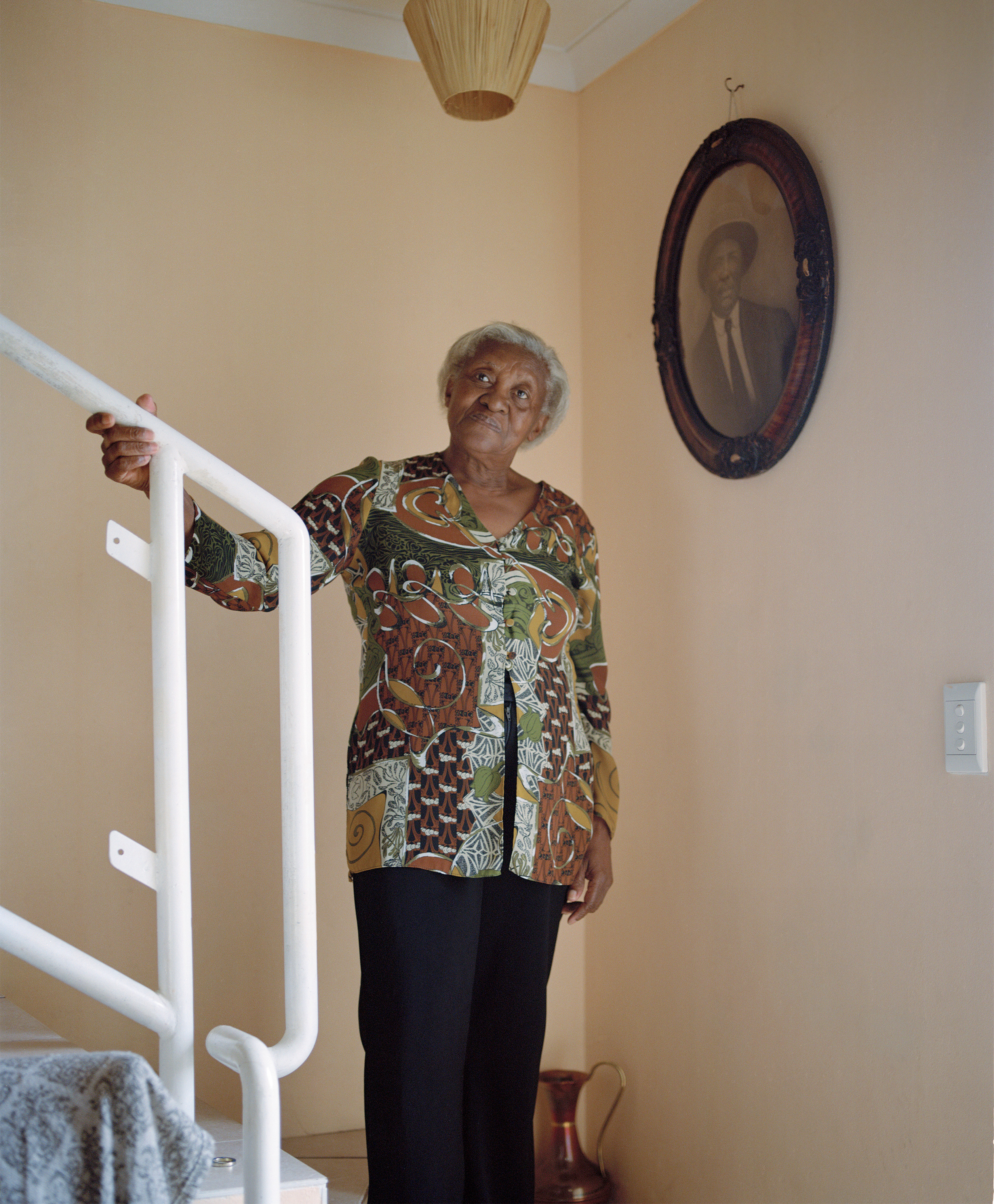 Susan Lewis, 76, is a resident of Cape Town's District Six neighborhood. Under the apartheid regime, the area was deemed "whites only," and the community's 60,000 residents were forcibly removed. Today, only 139 homes, including Lewis's, have been rebuilt for the community's former residents. (Sarah Nankin for TIME)