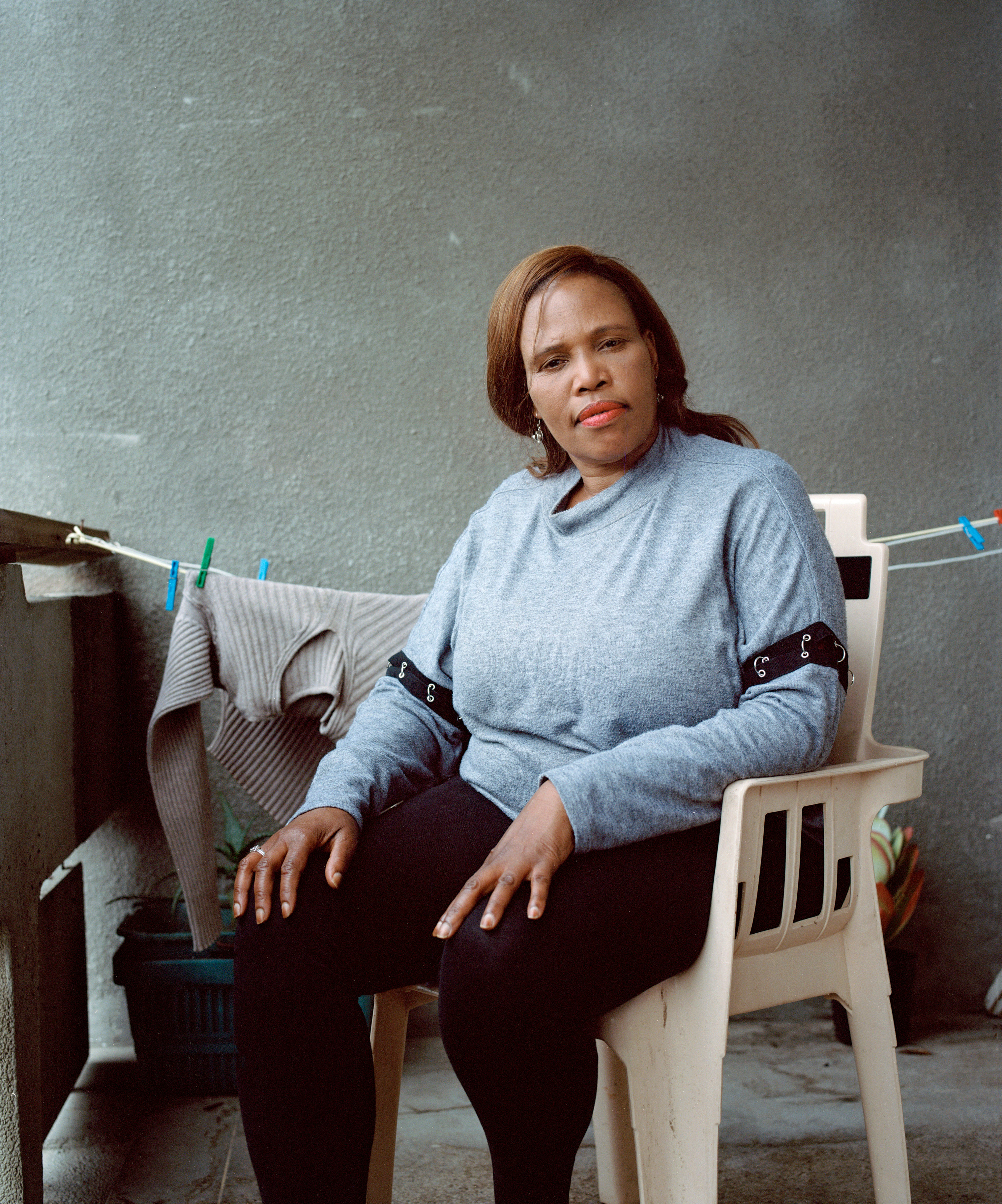 Elizabeth Gqoboka, a founding member of the “Reclaim the City” group, has been living in a second-floor apartment in an abandoned nurses’ home for nearly three years. (Sarah Nankin for TIME)