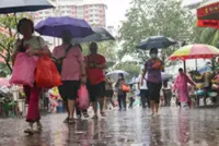 Flight disruptions, lift closures, dancing in the rain – Singapore contends with non-stop rain