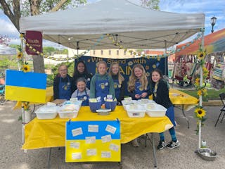 Standing in unity: from left, Shea Engle, Alanna Flynn, Lily Jacobson (seated), Camille Hohman, Grace Prose, Cammie Sammon, Mary Lou Street