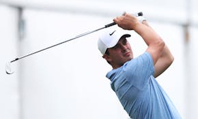 Davis Thompson follows through on his seventh hole tee shot at the John Deere Classic.