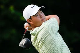 Tom Kim hits from the 13th tee during the third round of the Travelers Championship at TPC River Highlands on Saturday in Cromwell, Conn.