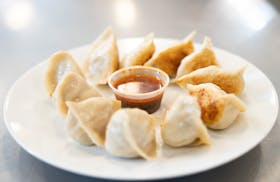 Freshly cooked dumplings from Saturday Dumpling Co. are plated Thursday, May 11, 2023, at Dots Gray Kitchen in Minneapolis.