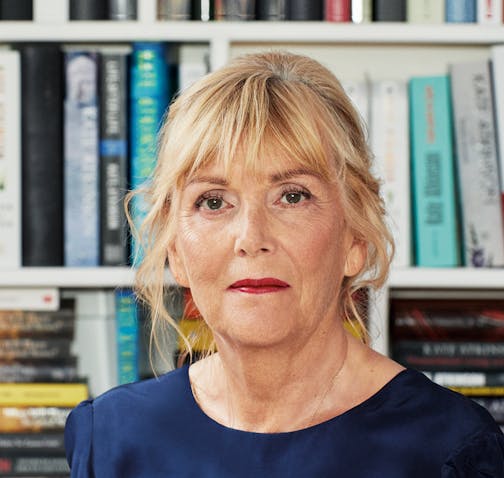 author Kate Atkinson is pictured in front of a bookcase