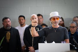 Restaurant owner David Fhima speaks at a press conference inside the Glass House event venue in Minneapolis on Tuesday.





Mayor Jacob Frey and the 