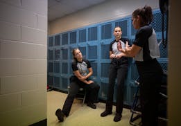 Leah Johnson, Macy Madsen, and Dayna Rethlake, from left, went over their game plan before officiating the Edina vs. Eagan girl's basketball game at E