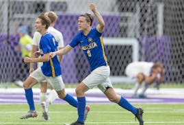 Wayzata's Jackson Widman celebrates their 3-2 overtime win over Woodbury during their 3A soccer state championship game at US Bank Stadium.