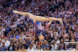 All eyes were on Suni Lee during her beam routine Friday at Target Center.