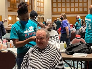 Haircuts mean happy faces at the annual 3,000 Acts of Kindness event Dec. 12.