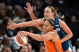 Lynx forward Alanna Smith defends against Connecticut forward Brionna Jones in the first quarter Thursday at Target Center.