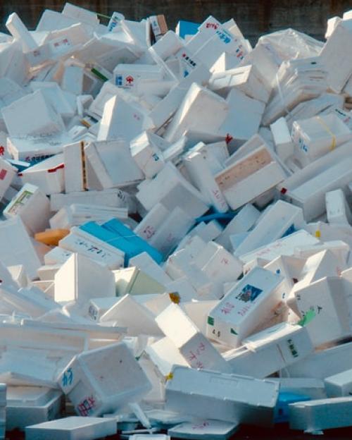 		A huge pile of white styrofoam shipping boxes jumbled together.
	