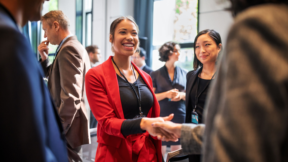 Professionals gather together at a meet and greet.