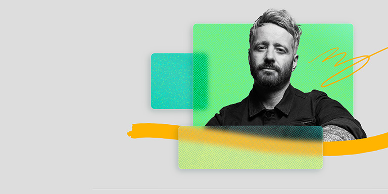 A photograph of James Thomas, the global head of technology at Dentsu Creative, on a colorful treated background