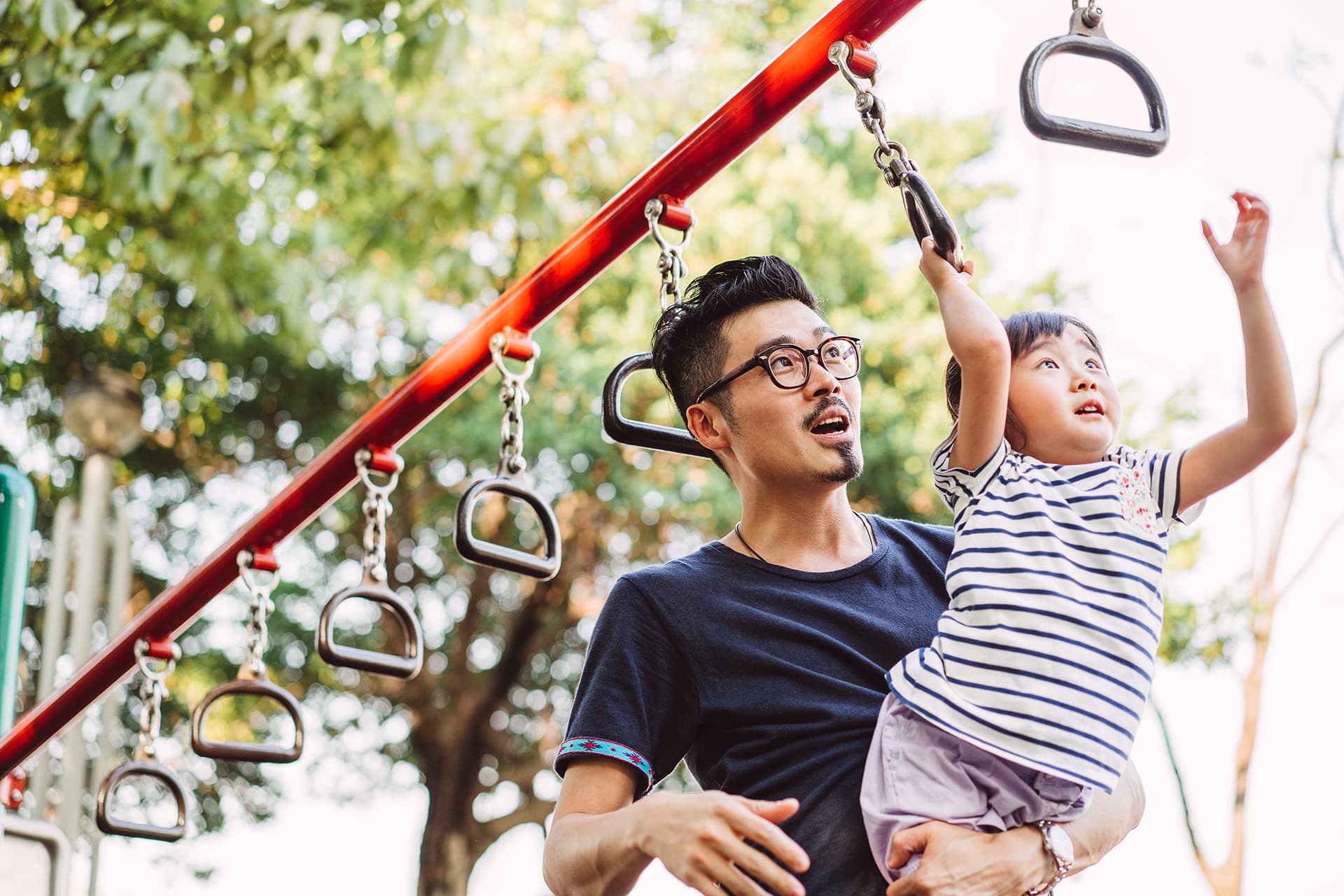 Father and son in playground