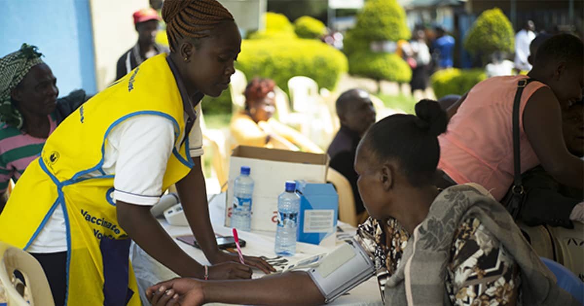 Physician taking patient's blood pressure