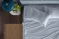 bamboo sheet set in sleepy blue styled room