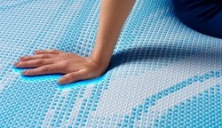 Hand showing cooling effect of the Breeze mattress cover