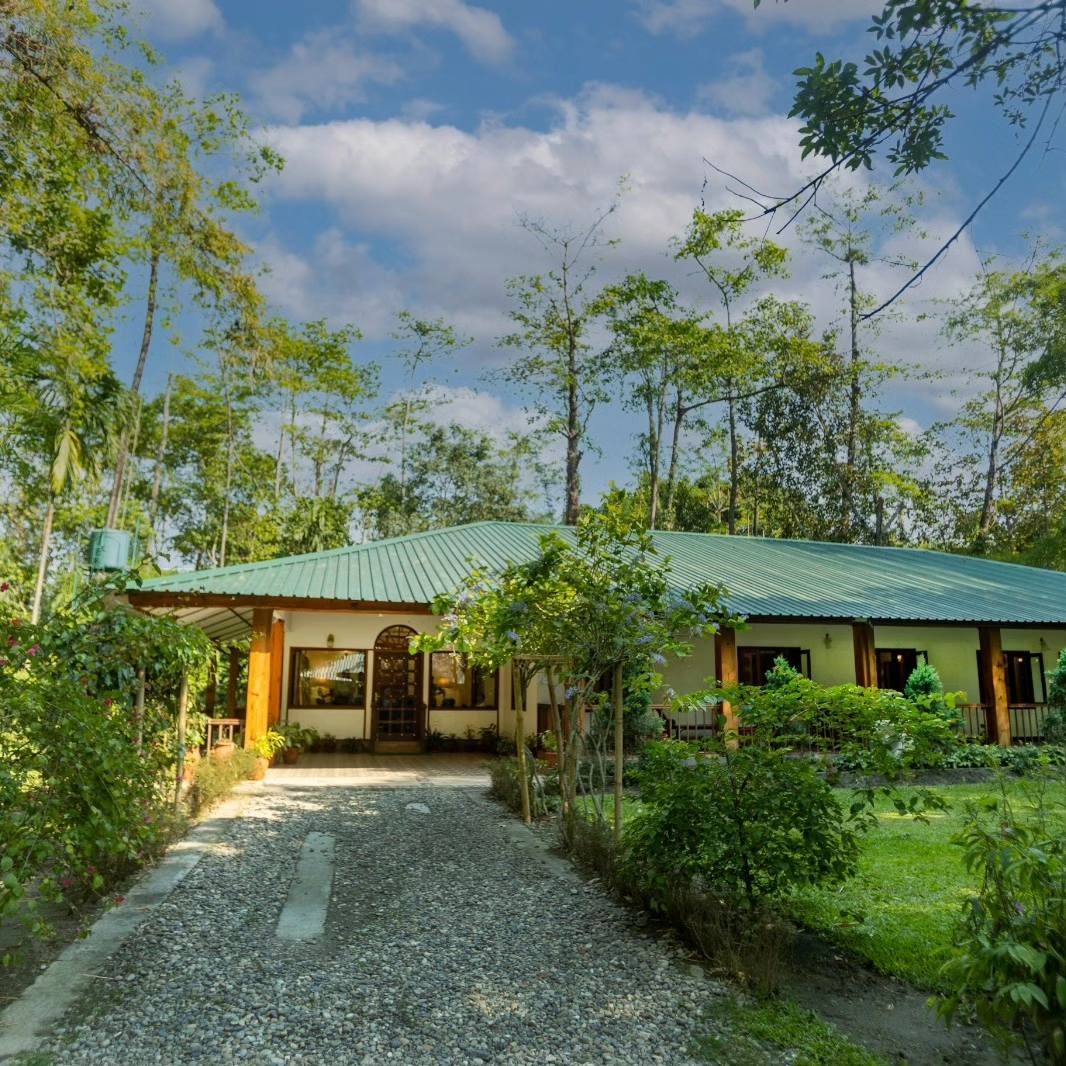 Image may contain Architecture Building Hotel Outdoors Housing Resort Plant House Aerial View and Driveway