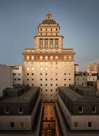 Image may contain City Urban Architecture Building Office Building High Rise Apartment Building and Clock Tower