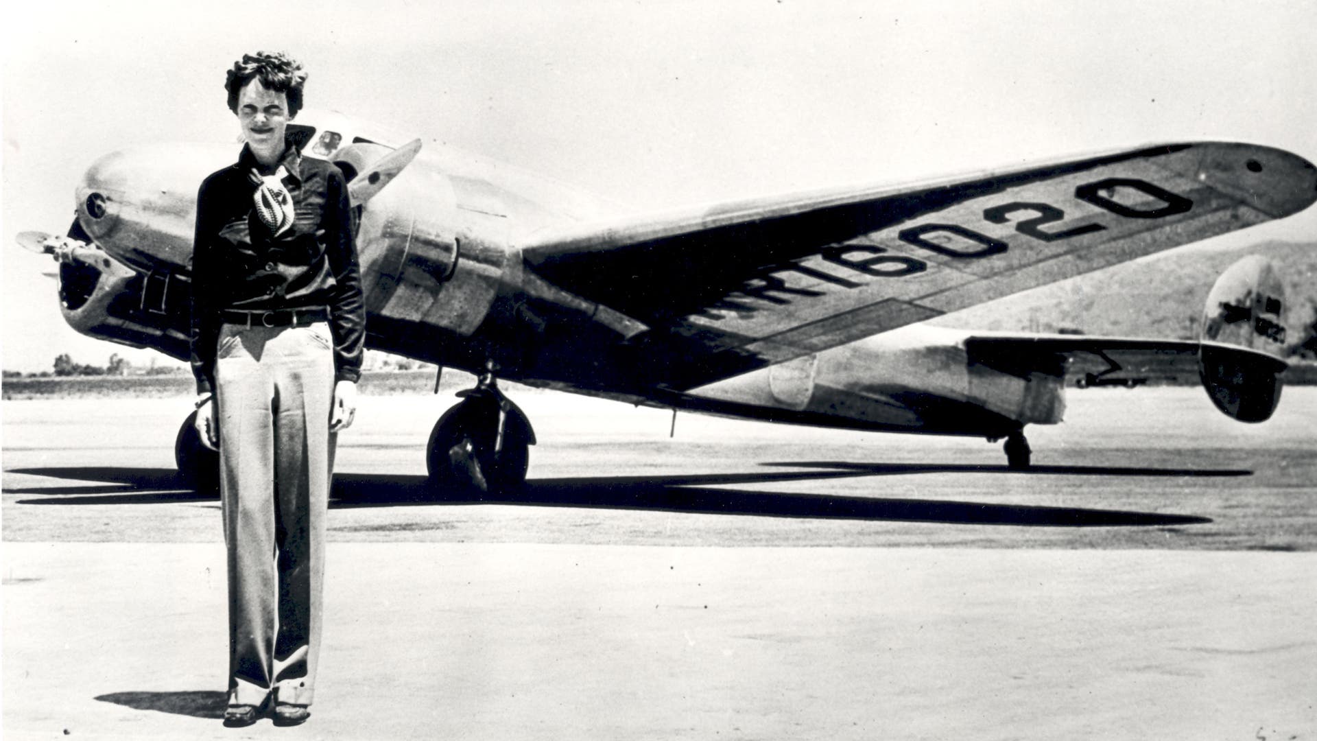 Amelia Earhart, pictured with the Lockheed Electra in which she disappeared in 1937.