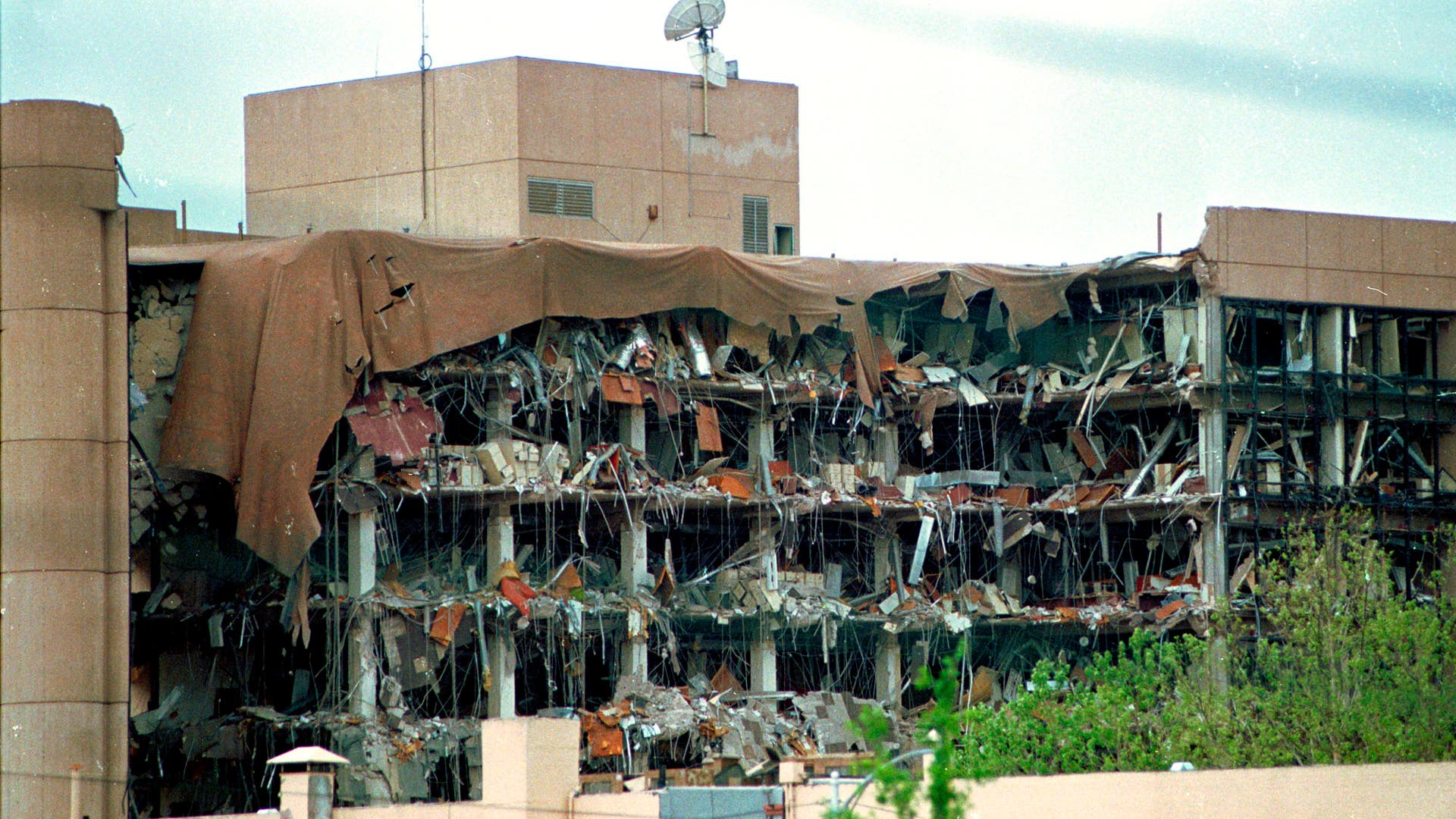 Oklahoma City BombingN220195 02: FILE PHOTO: Protective covering drapes over the Alfred P. Murrah Federal Building in Oklahoma City, April 19, 1995 where a terrorist bomb killed 168 people. On the fifth anniversary of the bombing, survivors, victims'' family members, friends and rescue personnel gathered at the bombing site April 19, 2000 to officially dedicate a national park built to honor the people killed in the 1995 bombing. (Photo by J. Pat Carter/Liaison)